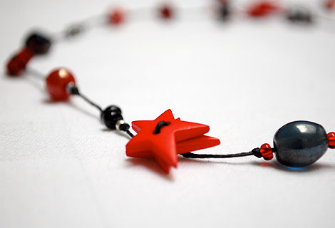 Alison mid-length lariat - Fun knotted lariat necklace with star and flower buttons, interspersed with mixed beads.