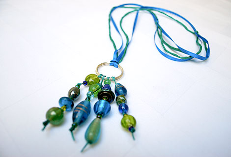 Jane long cluster pendant with sterling silver hoop - Stylish bead cluster pendant and sterling silver hoop hanging from a cord of green silk and blue iridescent ribbon. Length is adjustable by sliding knots.