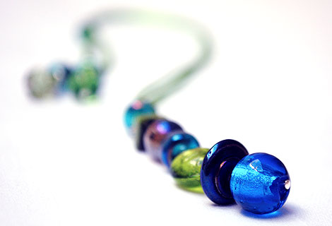 Harlequin peacock blue/green long drop pendant - Funky and bright, this pendant is designed to be worn long, but can be adjusted in length using a sliding bead. Beautiful peacock colour beads hang from silky ribbon cord.