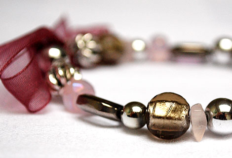 Anna pink/silver/gold bracelet - Lovely, easy-to-wear slip on bracelet, with pink, silver and gold beads, and finished off with a burgundy organza ribbon bow.