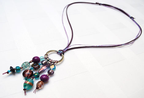Jane aubergine/turquoise long cluster pendant - Stylish bead cluster pendant and sterling silver hoop hanging from a cord of green silk and blue iridescent ribbon. Length is adjustable by sliding knots.