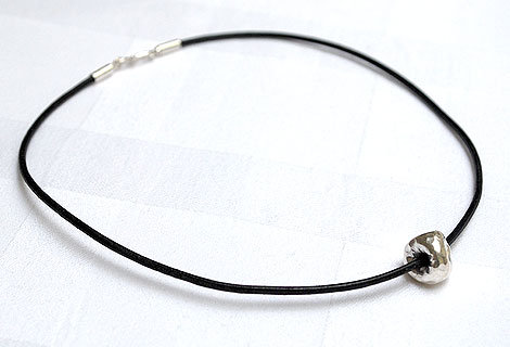 Kate silver ball pendant - Light and simnple sterling silver hammered ball on leather cord. Sterling silver ‘S’ hoop clasp.