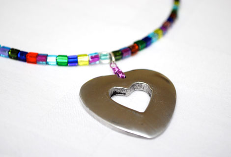 Madeleine heart pendant - Shiny heart pendant hanging from a necklace of sparkling multi-coloured Miyuki cube beads. Lobster clasp and chain.