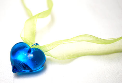 Sweetheart blue pendant - A clear glass heart strung onto organza ribbon. Fastened with a lobster clasp